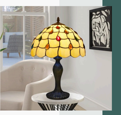 Tiffany style 10-Inch Antique table lamp on a white surface with a blurred background