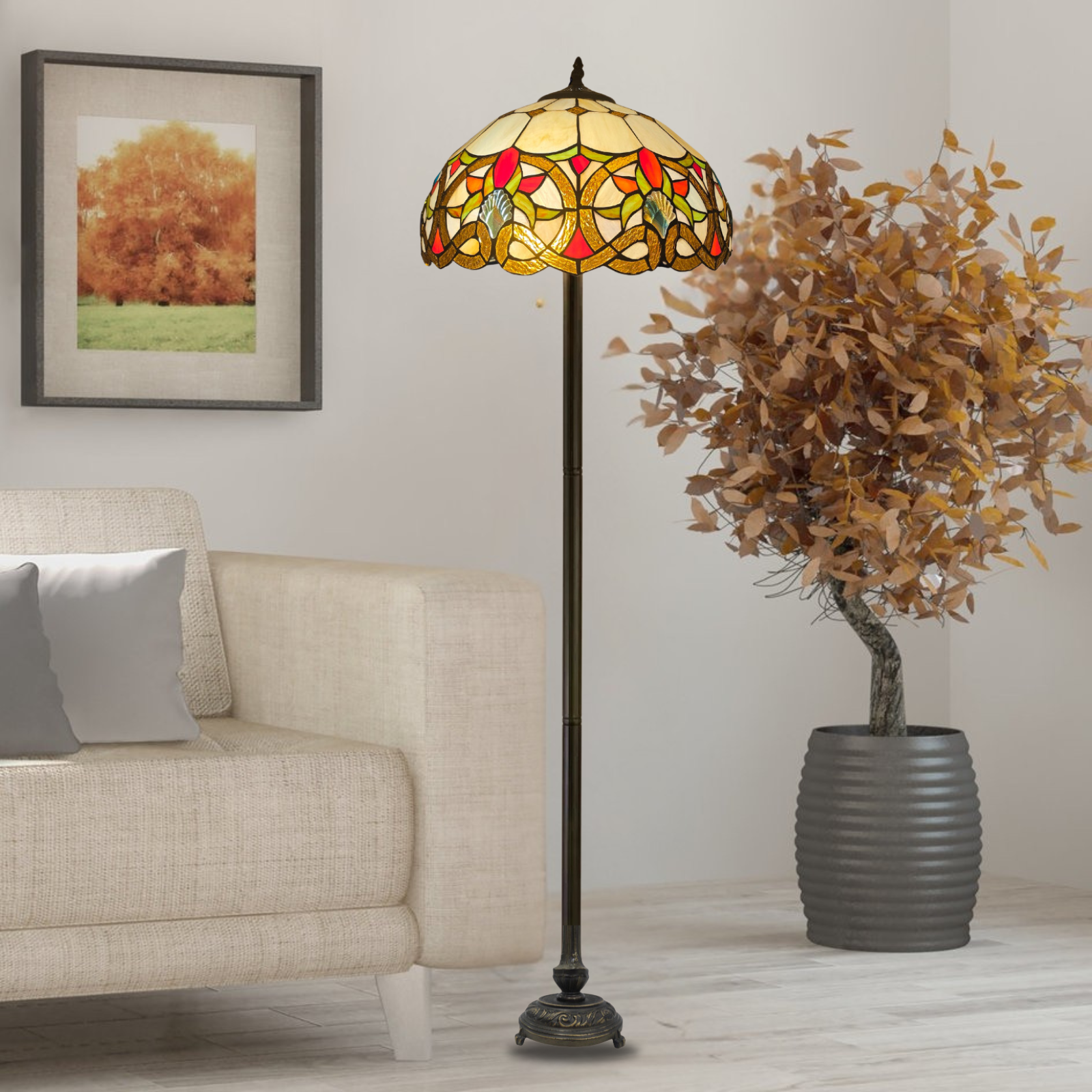A vintage style multicolor stained glass 16 inch tiffany floor lamp placed in a living room beside a sofa and a plant