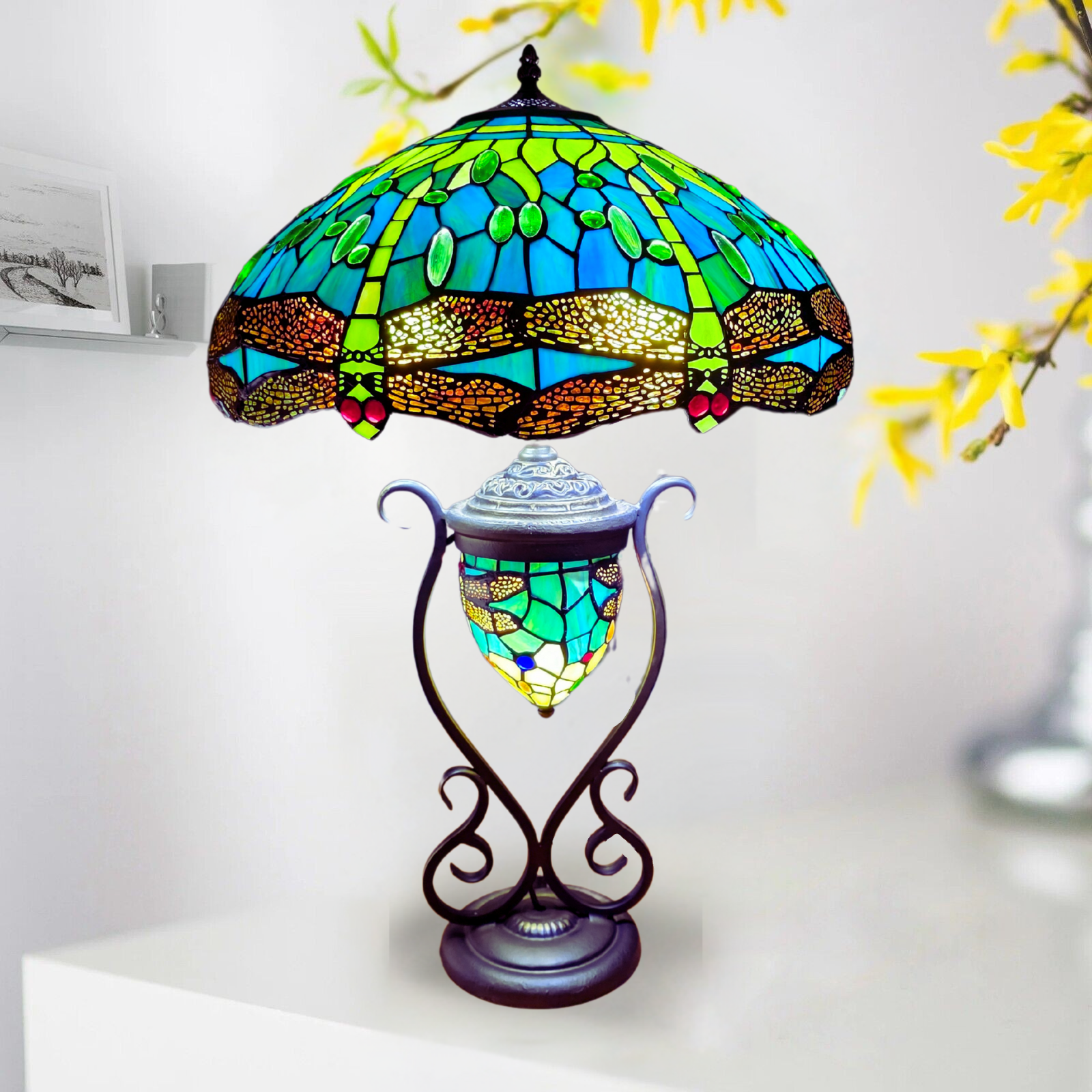 An 18 inch antique Tiffany style green color cluster table lamp with a stained glass shade and metal base, displaying a multicolored pattern.
