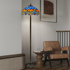 blue and orange 16 inch dragonfly stained glass tiffany style floor lamp placed in a corner beside table and chair