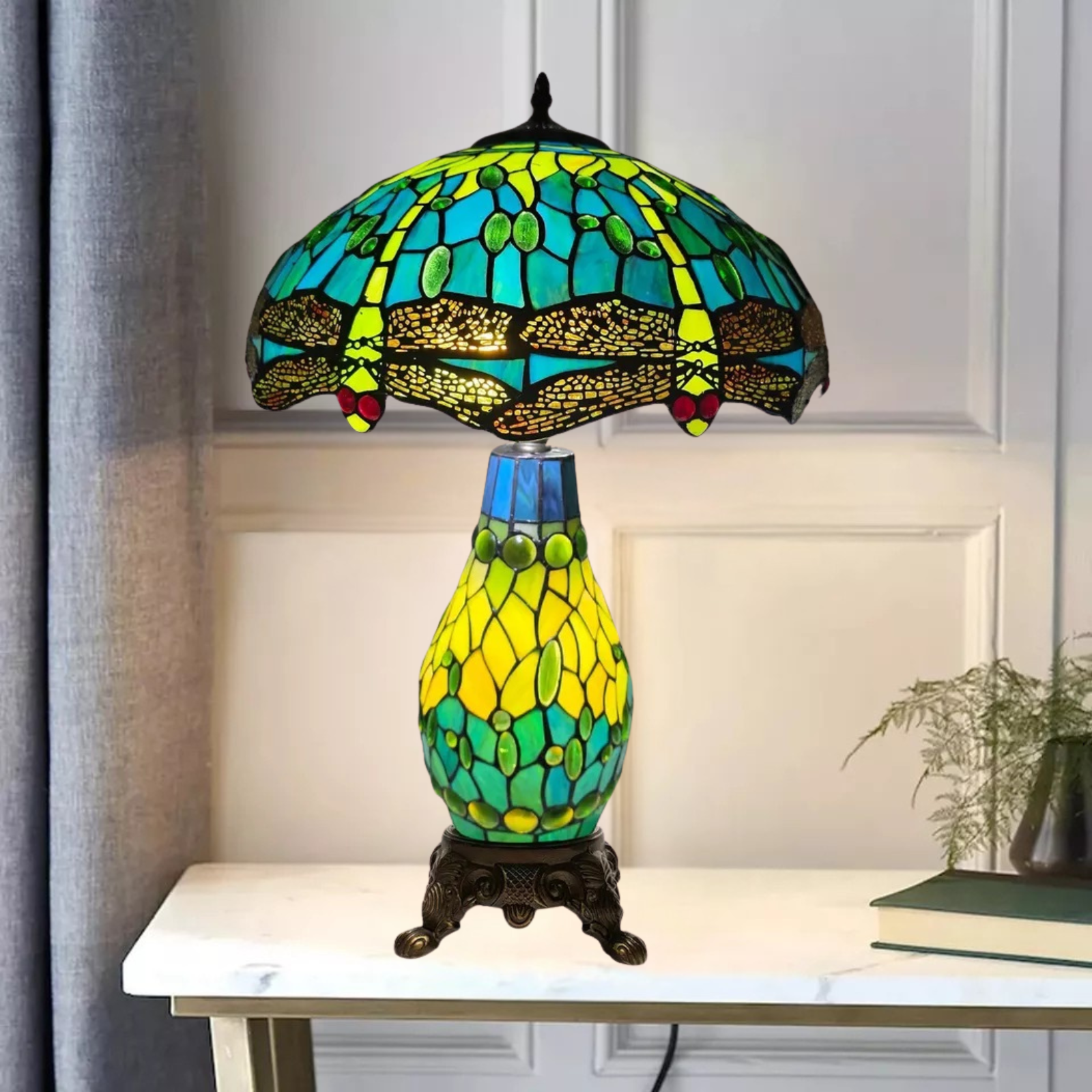 A 16 inch green stained glass cluster table lamp with a white background