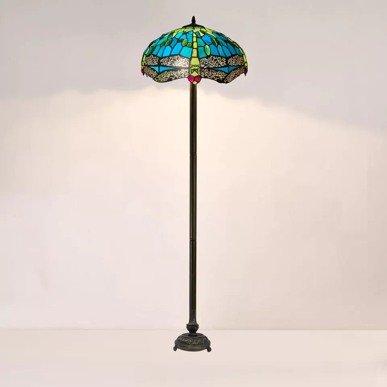 A green stained large tiffany floor inch 16 inch with a white background