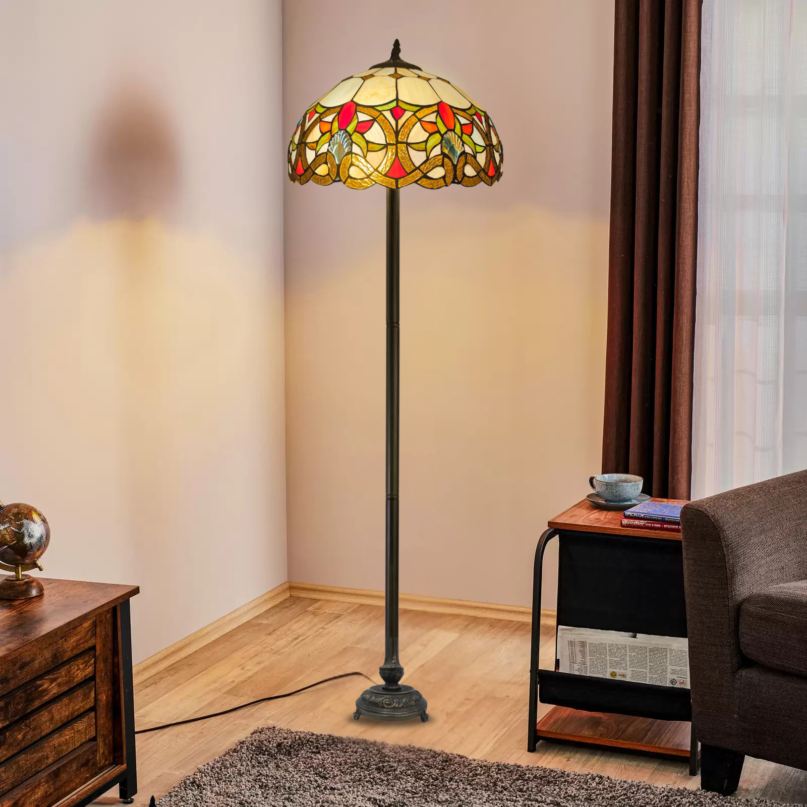 A tiffany style 16 inch multicolor vintage large floor lamp placed in a room beside a sofa and table