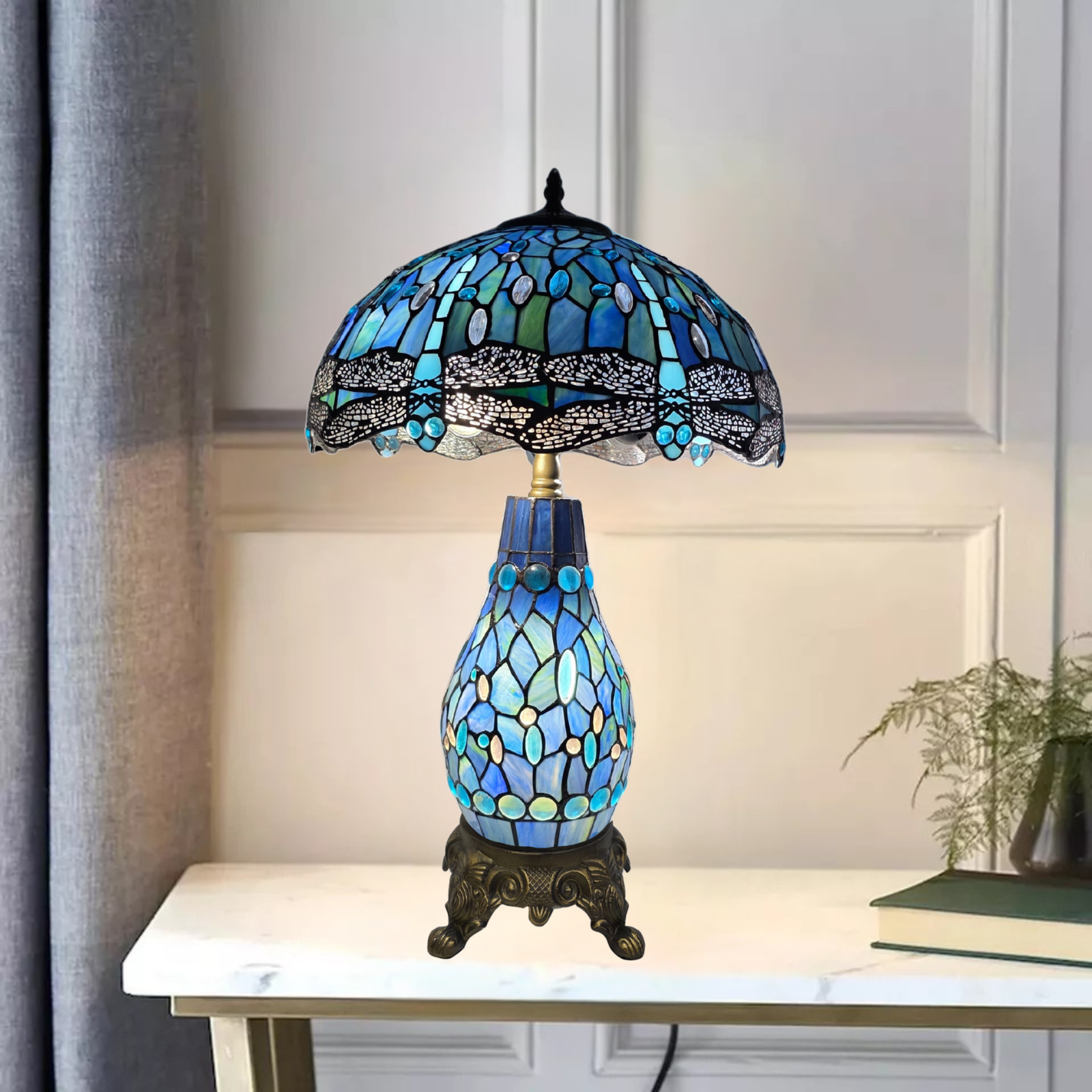 Blue & black 16-inch tiffany style stained glass cluster table lamp on a white surface with a neutral background